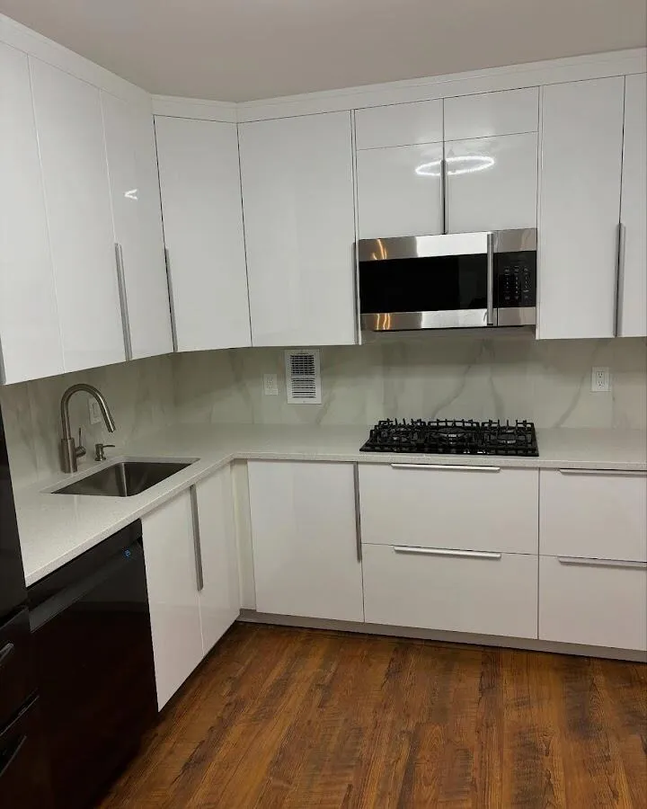 Restored kitchen with white cabinets after water damage in Manhattan